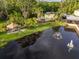 Community pool and cabana with a beautiful pond view at 11260 Kapok Grand Cir, Madeira Beach, FL 33708