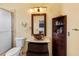 Bathroom featuring glass enclosed shower, sink with unique design, decorative lighting and built-in storage at 11260 Kapok Grand Cir, Madeira Beach, FL 33708