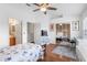 Bright bedroom features vaulted ceilings, wood floors, and sliding closet doors at 11260 Kapok Grand Cir, Madeira Beach, FL 33708