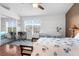 Bedroom featuring ceiling fan, hardwood floors, and a large window plus neutral paint at 11260 Kapok Grand Cir, Madeira Beach, FL 33708