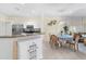 Cozy dining area next to the kitchen and living room, bright and airy at 11260 Kapok Grand Cir, Madeira Beach, FL 33708