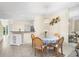 Charming dining area with table and chairs, open to other rooms at 11260 Kapok Grand Cir, Madeira Beach, FL 33708