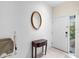 Inviting entryway with neutral tones and a stylish decorative mirror at 11260 Kapok Grand Cir, Madeira Beach, FL 33708