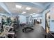 Community gym with free weights, machines, and ample workout space at 11260 Kapok Grand Cir, Madeira Beach, FL 33708