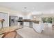 Bright kitchen featuring granite countertops and stainless steel appliances at 11260 Kapok Grand Cir, Madeira Beach, FL 33708