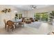 Inviting living room with comfortable seating and sliding glass doors to outdoors at 11260 Kapok Grand Cir, Madeira Beach, FL 33708