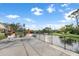 Relaxing patio area overlooks beautiful pond with a water feature at 11260 Kapok Grand Cir, Madeira Beach, FL 33708
