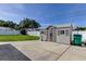 Backyard featuring a shed, green grass and privacy fence at 11487 80Th Ave, Seminole, FL 33772