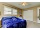 Bedroom with natural light from the window and a ceiling fan at 11487 80Th Ave, Seminole, FL 33772