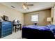 Bedroom features tile floors, a ceiling fan, a vanity, and a dresser at 11487 80Th Ave, Seminole, FL 33772