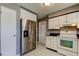 Well-equipped kitchen featuring stainless steel refrigerator and modern appliances at 11487 80Th Ave, Seminole, FL 33772