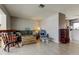 Bright living room with tile flooring, neutral tones, and comfortable seating area at 11487 80Th Ave, Seminole, FL 33772