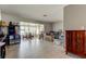 Bright living room with tile flooring, neutral tones, and versatile furniture at 11487 80Th Ave, Seminole, FL 33772