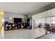 Bright living room with tile flooring, neutral tones, and view of office space at 11487 80Th Ave, Seminole, FL 33772