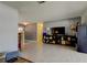 Bright living room with tile flooring, neutral tones, and entertainment center at 11487 80Th Ave, Seminole, FL 33772