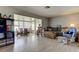 Bright living room with tile flooring, neutral tones, and versatile furniture at 11487 80Th Ave, Seminole, FL 33772