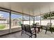 Covered back porch with seating area at 11487 80Th Ave, Seminole, FL 33772