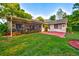 The house boasts a screened lanai that adjoins a covered red-brick patio area perfect for dining outside at 12024 Stone Crossing Cir, Tampa, FL 33635