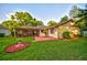 Backyard features a patio and a lawn, perfect for entertaining or relaxing in a serene outdoor setting at 12024 Stone Crossing Cir, Tampa, FL 33635