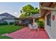 This backyard patio and screened lanai offers a space for outside dining and peaceful relaxation at 12024 Stone Crossing Cir, Tampa, FL 33635