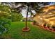 Lush green backyard features vibrant vegetation, space to relax, and space for entertaining at 12024 Stone Crossing Cir, Tampa, FL 33635