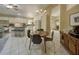 Bright dining area connected to the kitchen and living space with seating for four at 12024 Stone Crossing Cir, Tampa, FL 33635