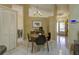 Cozy dining area with chandelier lighting is conveniently situated adjacent to the kitchen at 12024 Stone Crossing Cir, Tampa, FL 33635