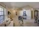 Open living space with neutral walls, tile entryway, carpeted living area, and cozy seating at 12024 Stone Crossing Cir, Tampa, FL 33635