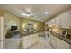 Open-concept layout showcases the kitchen, living room, and desk area with lots of natural light at 12024 Stone Crossing Cir, Tampa, FL 33635