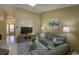 Comfortable living room with a TV and seating area, seamlessly connected to the entryway for easy access at 12024 Stone Crossing Cir, Tampa, FL 33635