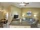 Open layout with a living area, dining space, and kitchen, perfect for modern living and entertaining at 12024 Stone Crossing Cir, Tampa, FL 33635
