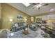 Cozy living room features a skylight, comfortable seating, and an adjacent kitchen area for convenient living at 12024 Stone Crossing Cir, Tampa, FL 33635