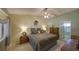 Comfortable bedroom featuring neutral tones, a ceiling fan, and a serene atmosphere at 12024 Stone Crossing Cir, Tampa, FL 33635