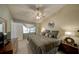Spacious bedroom with vaulted ceilings, ceiling fan, a window, and warm natural light at 12024 Stone Crossing Cir, Tampa, FL 33635