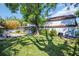 Spacious backyard featuring a well-maintained lawn and mature trees at 1226 Serpentine S Dr, St Petersburg, FL 33705