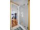 Modern shower with glass door and view into the next room at 1226 Serpentine S Dr, St Petersburg, FL 33705