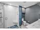 View of an updated bathroom with a tiled walk-in shower and double sink vanity at 1226 Serpentine S Dr, St Petersburg, FL 33705