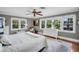 The primary bedroom has lots of natural light with a window view and hardwood floors at 1226 Serpentine S Dr, St Petersburg, FL 33705