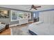 The primary bedroom has hardwood floors, a window view and natural light at 1226 Serpentine S Dr, St Petersburg, FL 33705