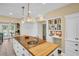Open kitchen design with expansive island, providing ample counter space and natural light at 1226 Serpentine S Dr, St Petersburg, FL 33705