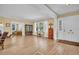 Bright and spacious living room with refinished wood flooring and an open floorplan at 1226 Serpentine S Dr, St Petersburg, FL 33705