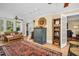 Stylish living room showcasing refinished wood floors and vintage furnishings at 1226 Serpentine S Dr, St Petersburg, FL 33705