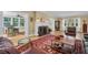 Comfortable living room with refinished wood floors and vintage furnishings at 1226 Serpentine S Dr, St Petersburg, FL 33705