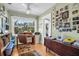 A quaint office space with wooden desk, chair and shelving, along with a light green wall at 1226 Serpentine S Dr, St Petersburg, FL 33705