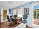 Bright office with hardwood floors, desk, and natural light from the windows at 1226 Serpentine S Dr, St Petersburg, FL 33705