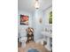 Charming powder room with light blue walls and decorative accents at 1226 Serpentine S Dr, St Petersburg, FL 33705