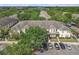 Aerial view showcasing the community's layout, landscaping, and ample parking areas at 12937 Trade Port Pl, Riverview, FL 33579
