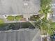 Bird's eye view displaying the property's rooftop, landscaping, and nearby parking areas at 12937 Trade Port Pl, Riverview, FL 33579
