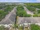 Enjoy this beautiful aerial view of a multi-Gathering residential community with mature trees and lush landscaping at 12937 Trade Port Pl, Riverview, FL 33579