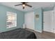 Bedroom with light blue walls, wood-look flooring, and closet at 12937 Trade Port Pl, Riverview, FL 33579